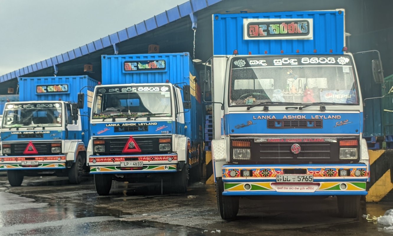 Udaya Transport delivery trucks at a beverage distribution loading bay in Sri Lanka